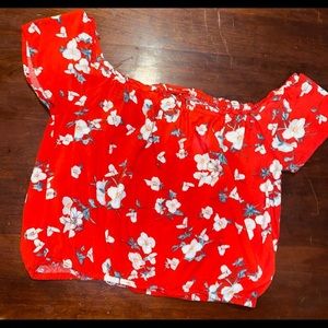 Top color anaranjado con flores,al hombligo